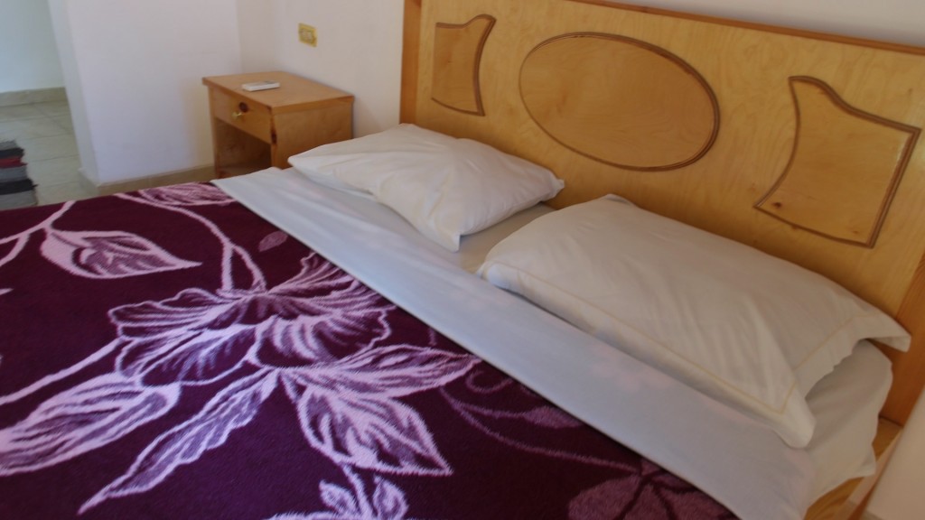 Comfortable beds with clean bedding and towels provided on daily basis.